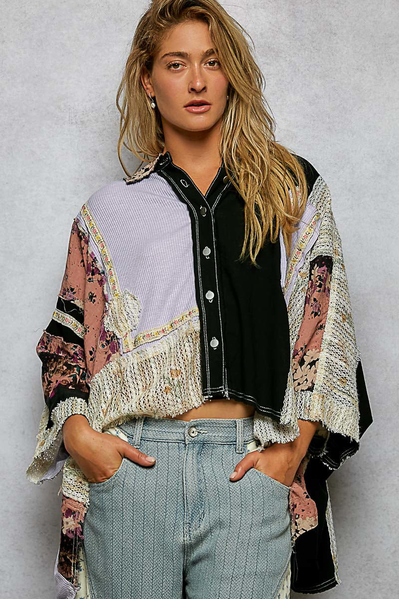 Woman in a patchwork crochet trim textured shirt worn open over a tank with jeans