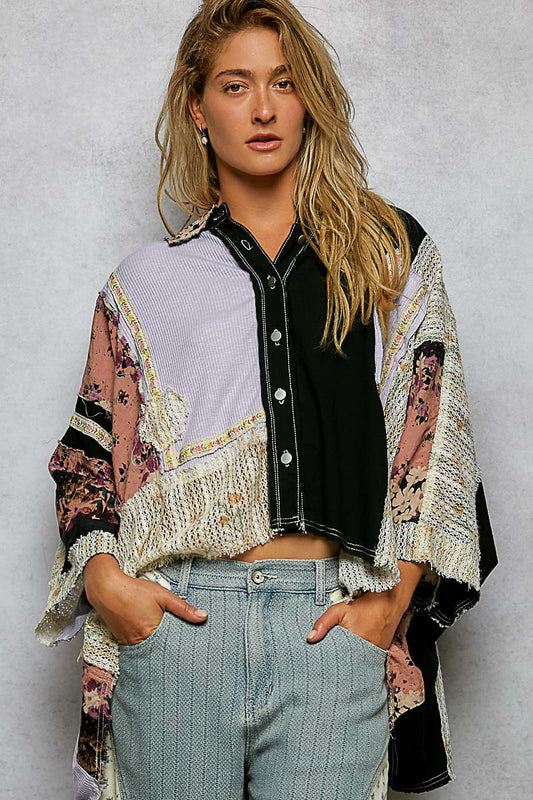 Woman in a patchwork crochet trim textured shirt worn open over a tank with jeans
