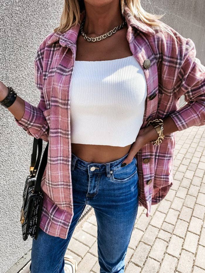 Woman wearing the pink plaid oversized longline shacket open over a white tank and jeans