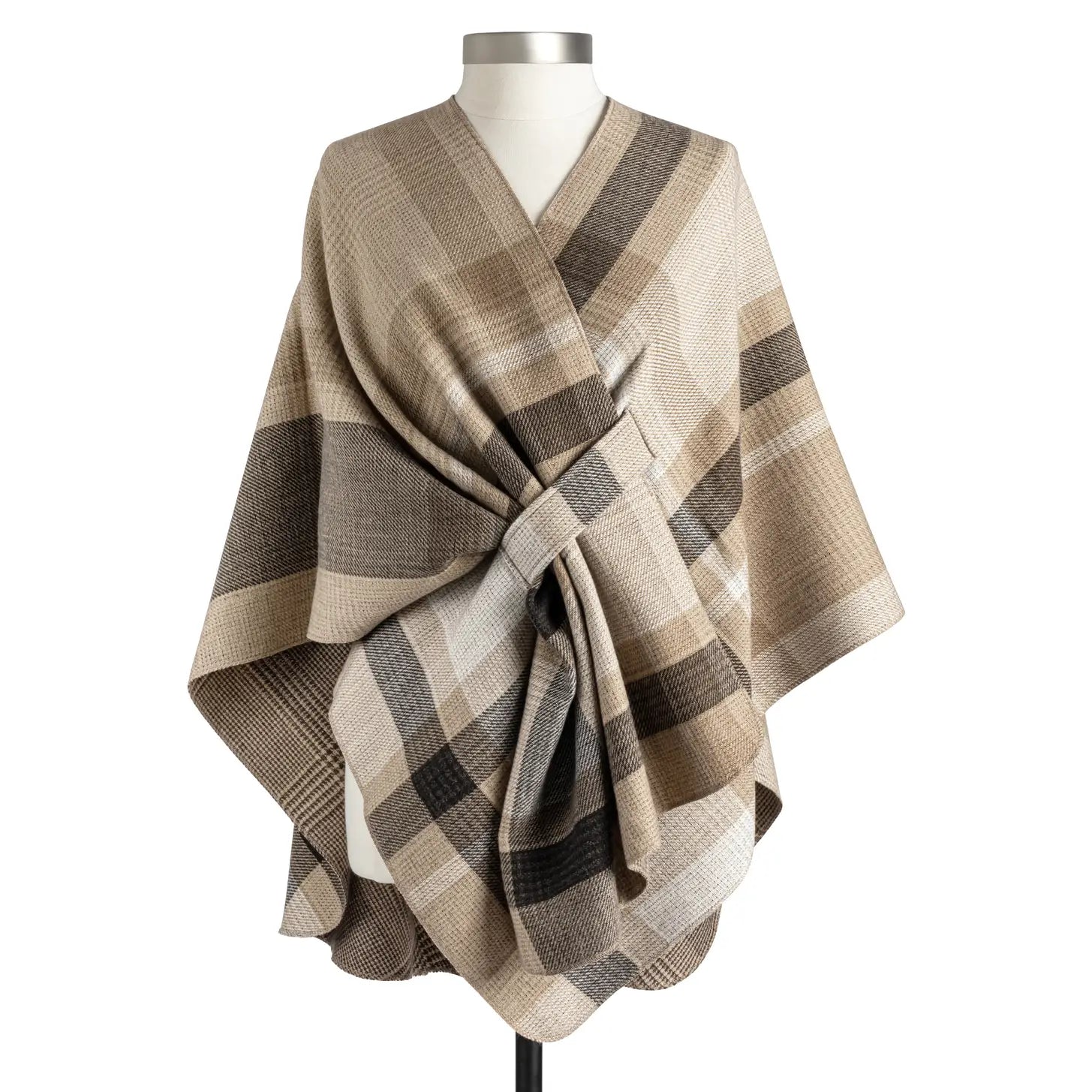 Camel, cream and brown plaid wrap draped on a dress form and cinched at the waist with a belt