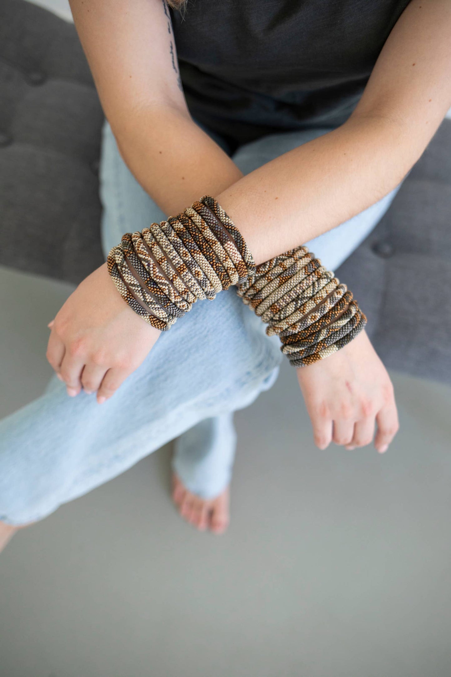 Hazel bead bracelets stacked on the wrist, worn with jeans