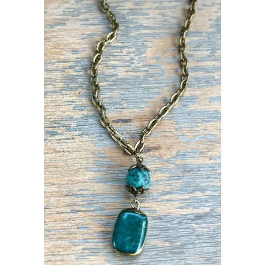 Short Sicily necklace with a green natural stone pendant on a bronze chain