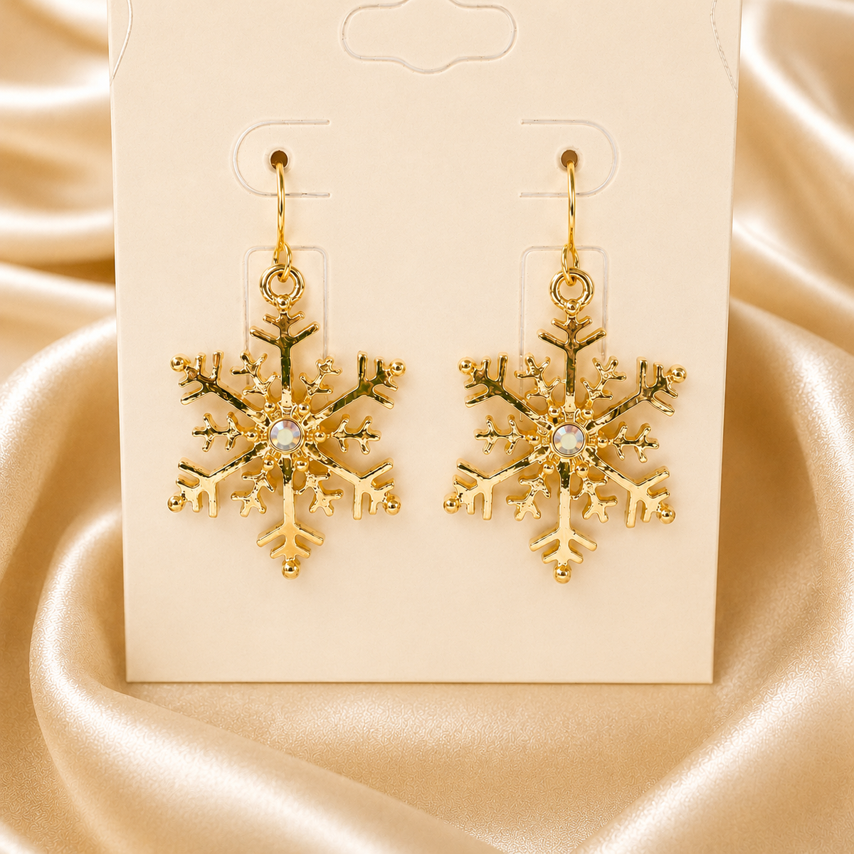 Same snowflake earrings in a gold tone; this listing is silver