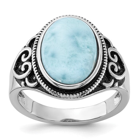 Oval larimar stone in an oxidized sterling silver ring with swirl filigree shoulders