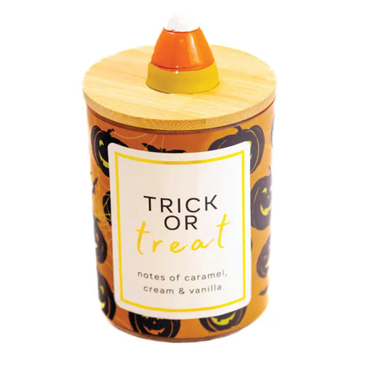 Trick or Treat scented 10 oz soy jar candle in a clear glass jar.